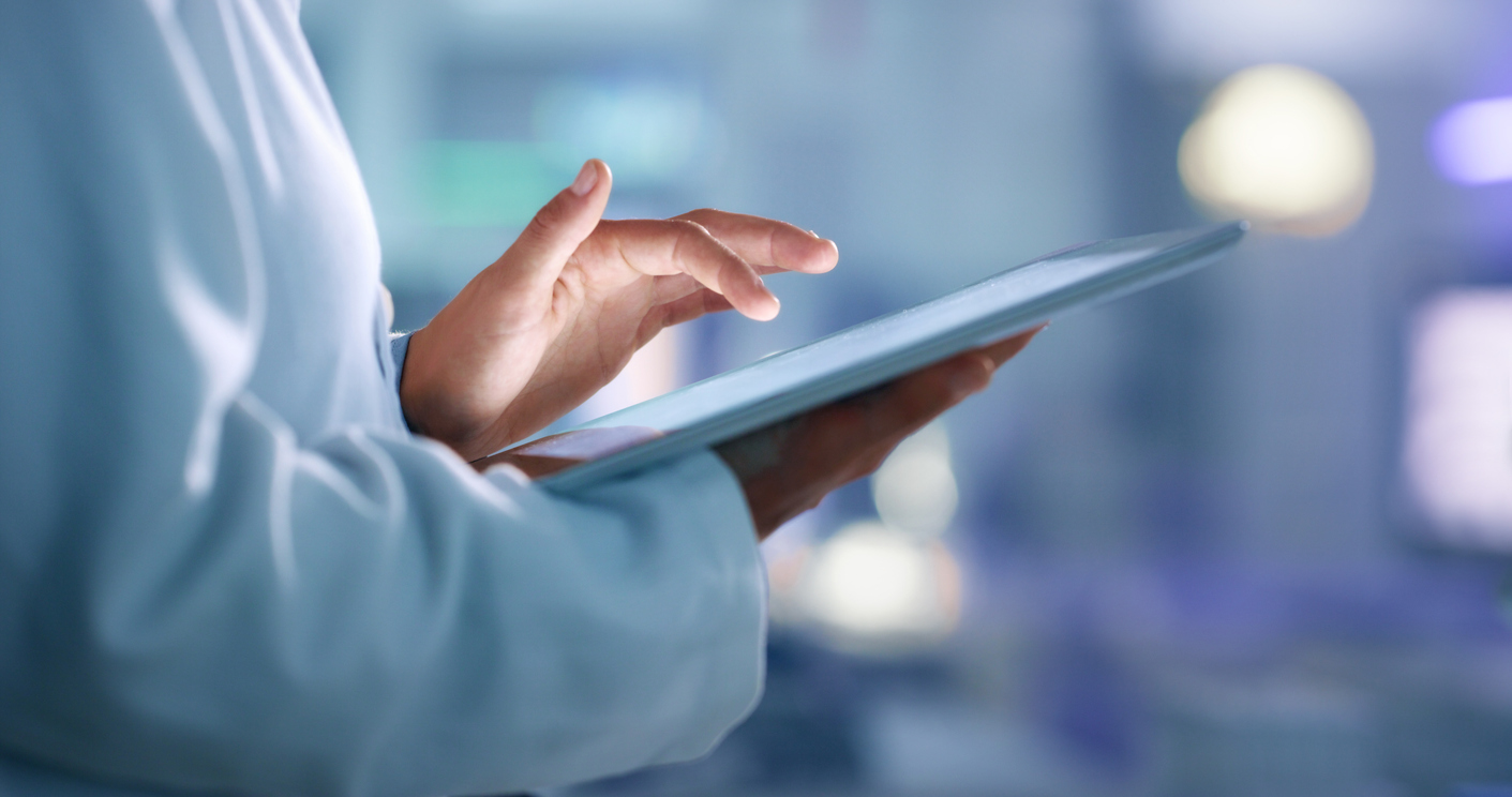 Doctor, researcher or scientist browsing the internet on a tablet for information while working at a lab, science facility or hospital. Expert, medical professional or surgeon searching the internet